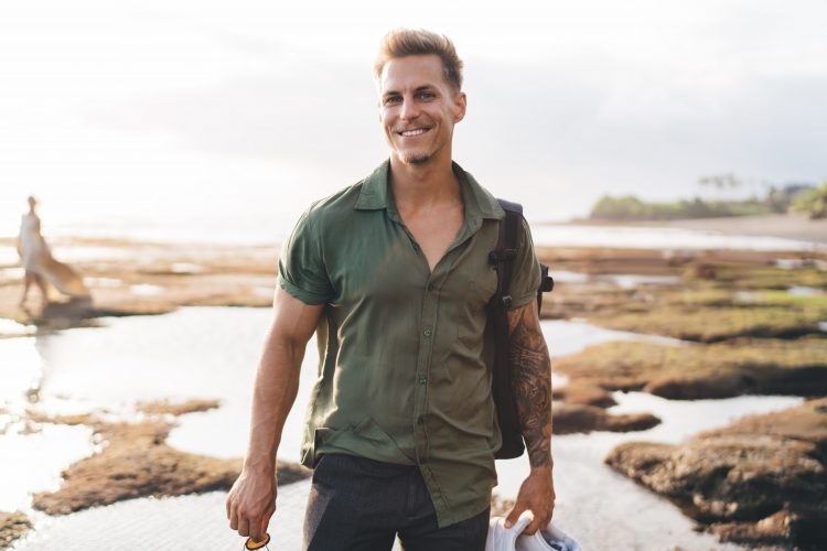 Positive,Young,Male,In,Casual,Clothes,With,Backpack,And,Toothy